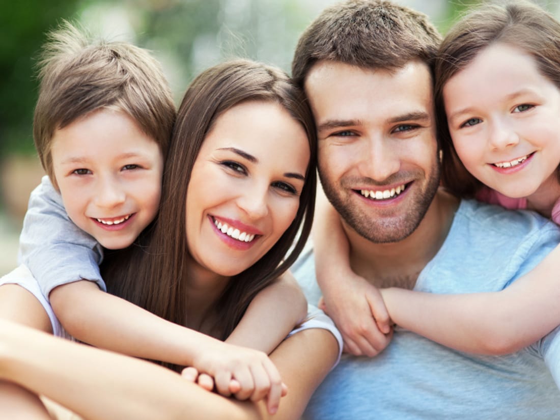 A smiling family of four