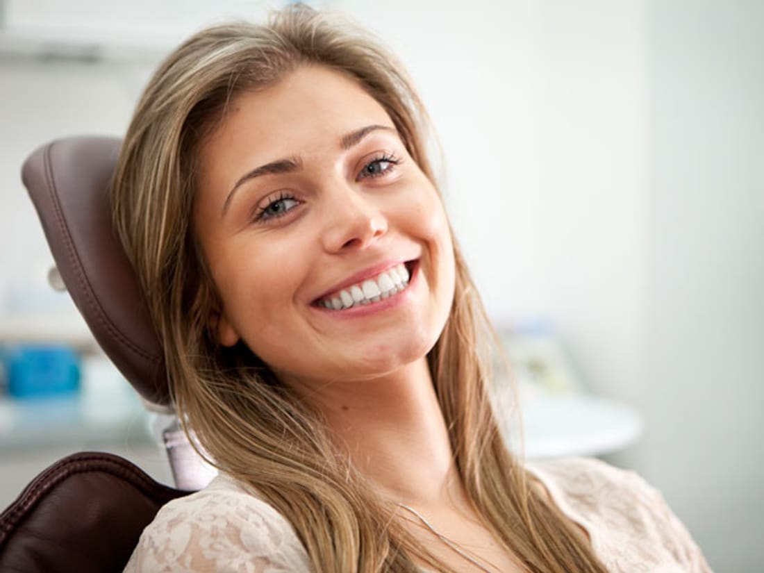 A relaxed patient smiling in the dental chair